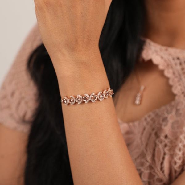 Woman wearing a diamond ring on her finger with a blurred background